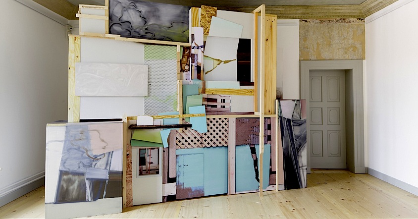 Wolfgang Ellenrieder: Bidonville, 2103, pigment, binder and structure printing on wood, cardboard and plastic, 300 x 410 x 120 cm 
Installation view ›Hybrid‹, Municipal Gallery Wolfsburg, DE, May 2013

